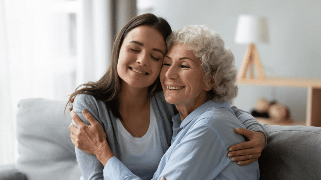 family caregiver hugging senior